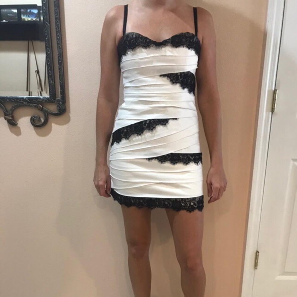 Bebe white satin dress with black lace details.